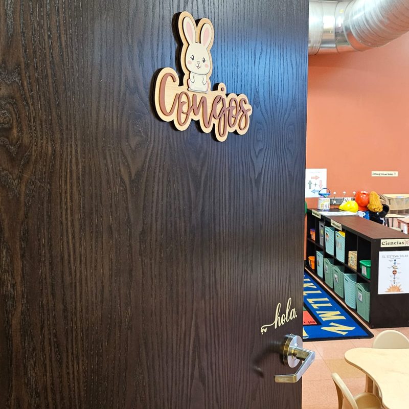 The Conejos classroom door with its wood-cut rabbit sign